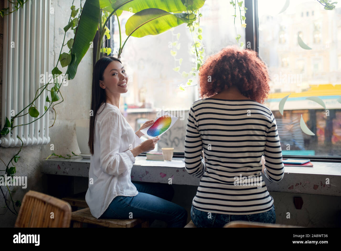 Two fashion designers creating new project having discussion Stock Photo
