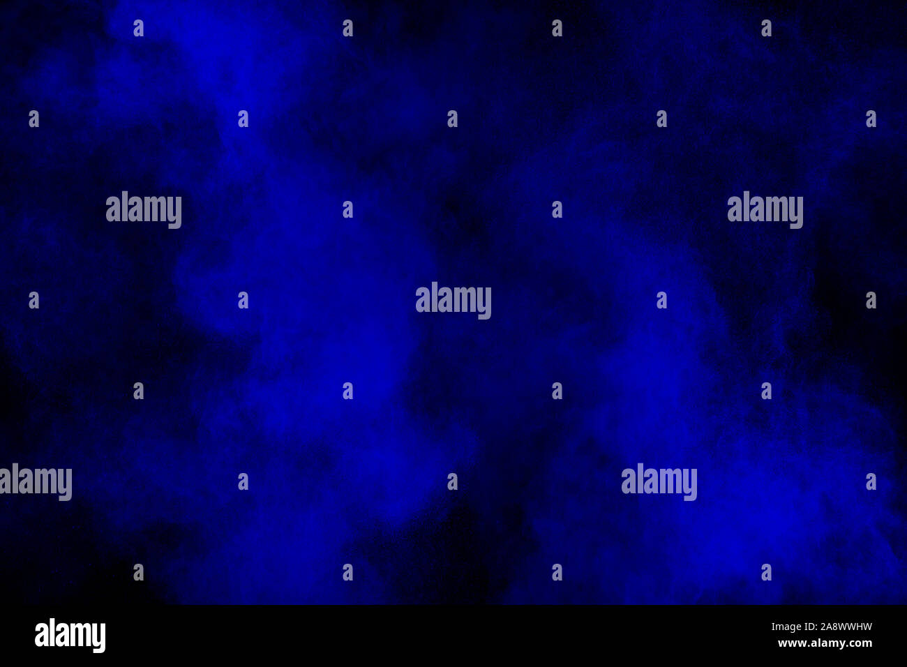 Exploding Dark Blue Background Blue powder explode cloud on black background.Launched blue dust ...