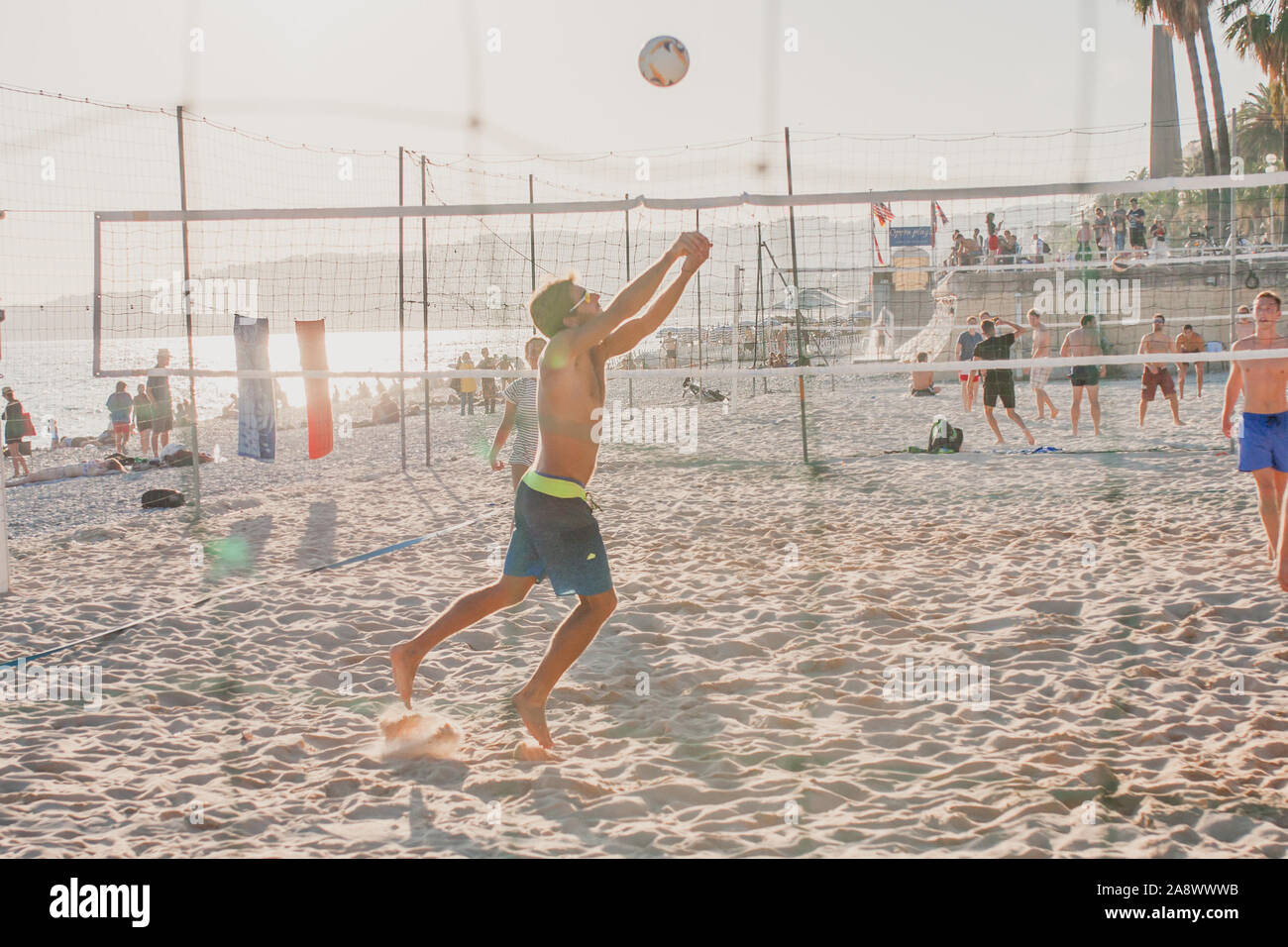 Nice, Provence / France - September 28, 2018: Young people on the beach playing beach volleyball Stock Photo