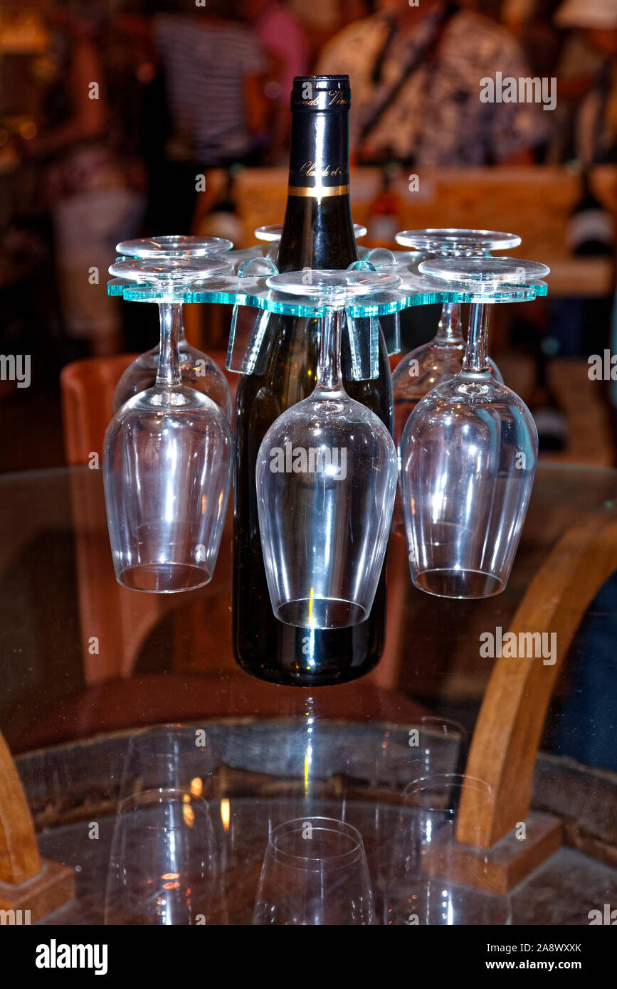 wine equipment, glasses holder around bottle, 6 stemmed glasses, product, wine tasting, cellar, degustation, Burgundy, Beaune, France, summer, vertica Stock Photo