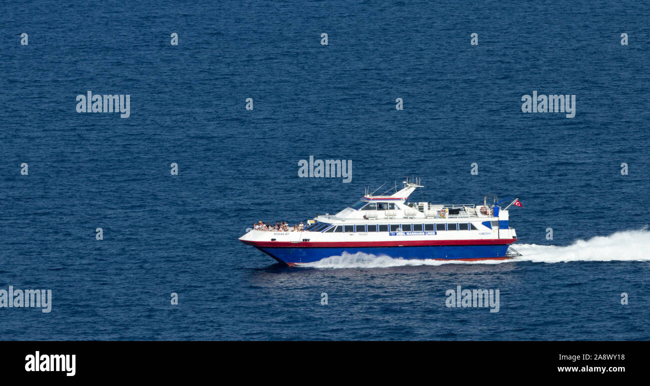 Turgutreis, Bodrum, Turkey, June 10th, 2019:  High speed catamaran seabus ferries tourists from Turgutreis to the Greek Island Kos. Stock Photo