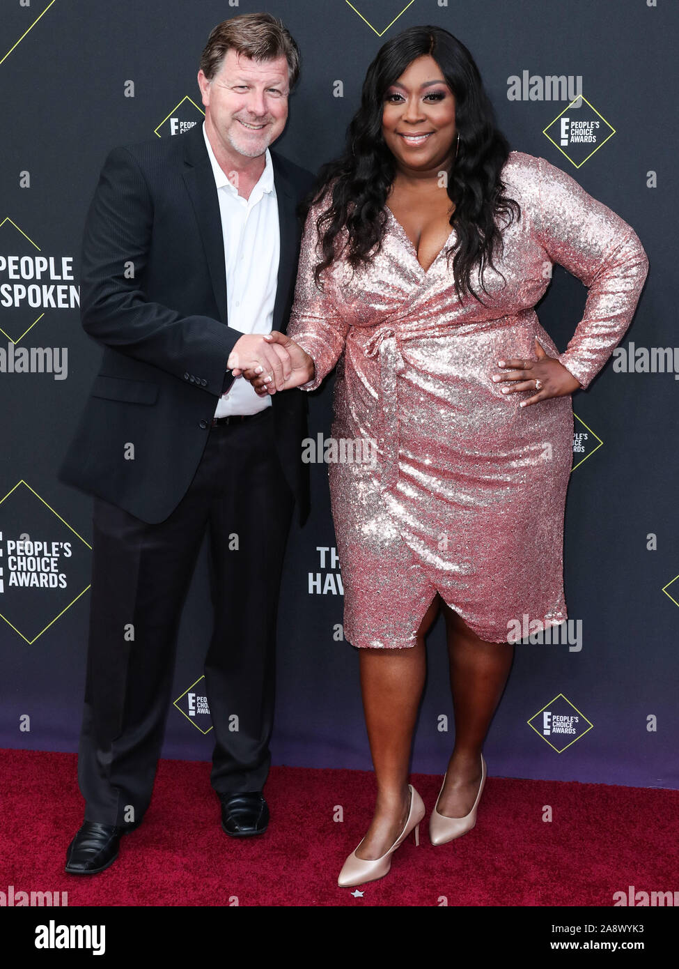 James Welsh and Loni Love arrive at the 2019 E! People's Choice Awards