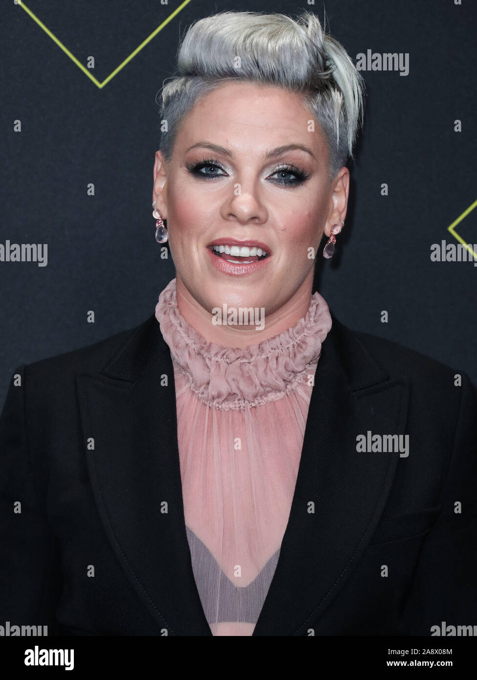 Singer P!nk, Pink wearing Giorgio Armani arrives at the 2019 E! People's  Choice Awards held at Barker Hangar on November 10, 2019 in Santa Monica,  Los Angeles, California, USA. (Photo by Xavier