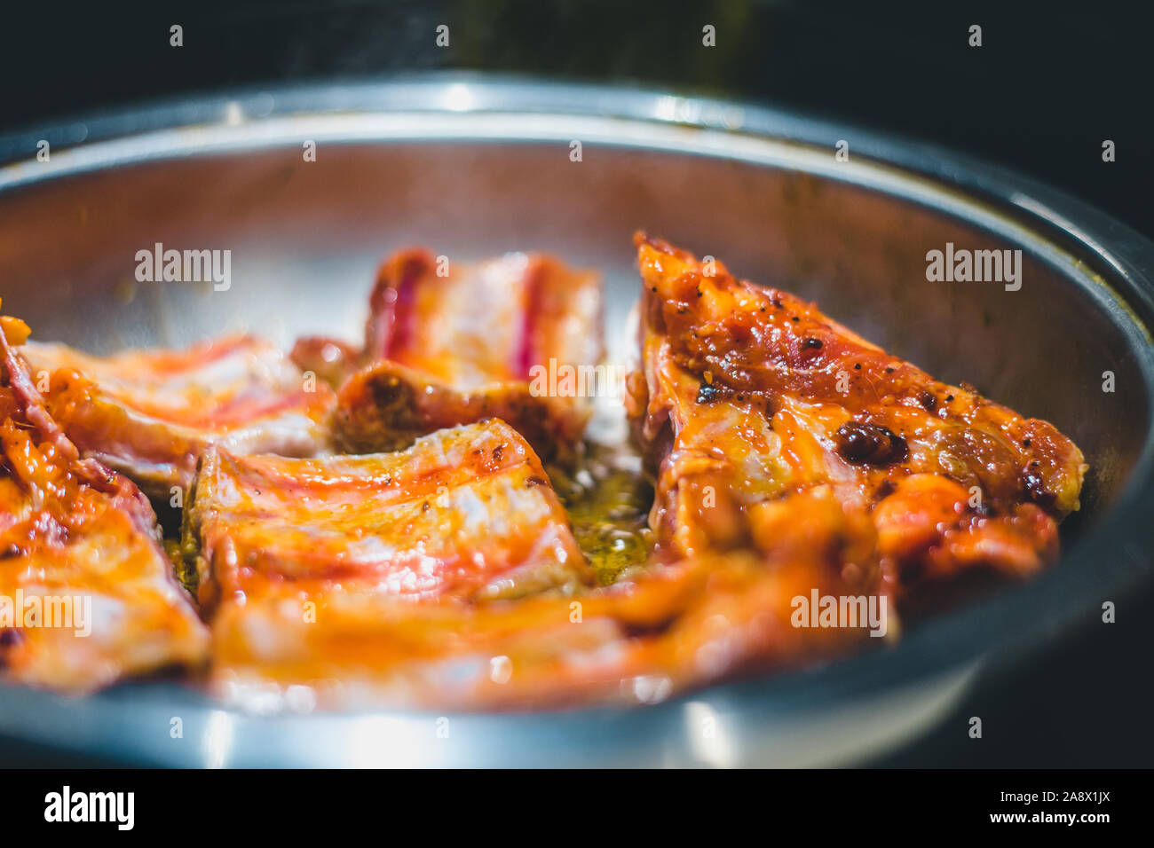 Delicious fried ribs in a pan Stock Photo Alamy