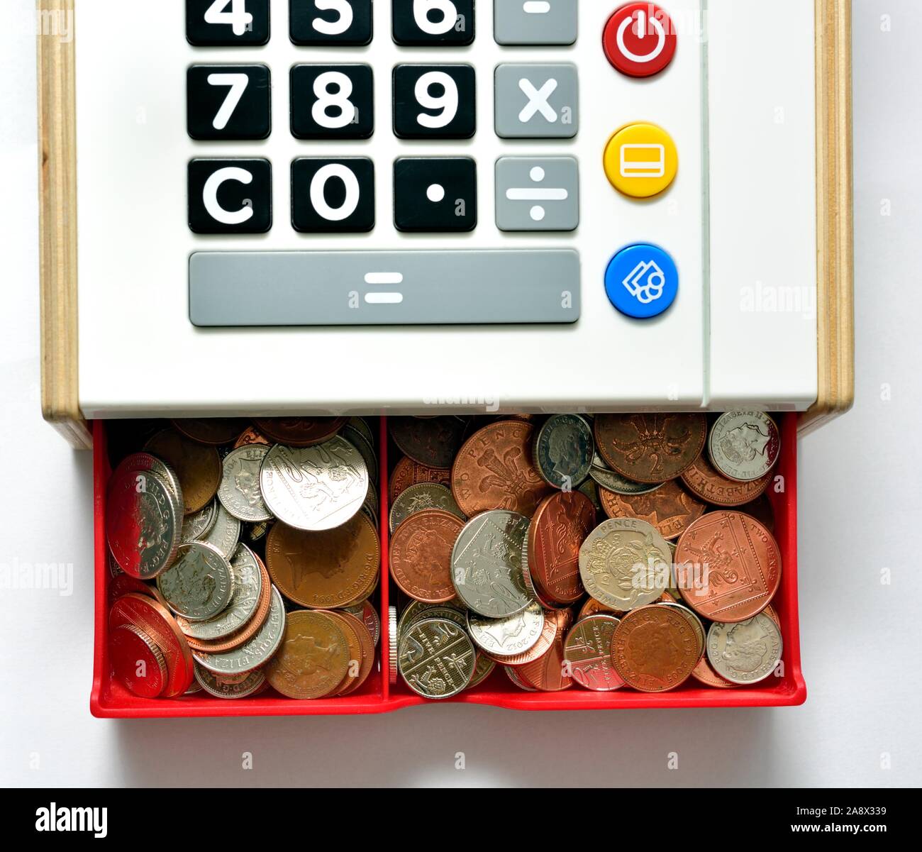 Children's play cash register cash till,with drawer full of small change Stock Photo