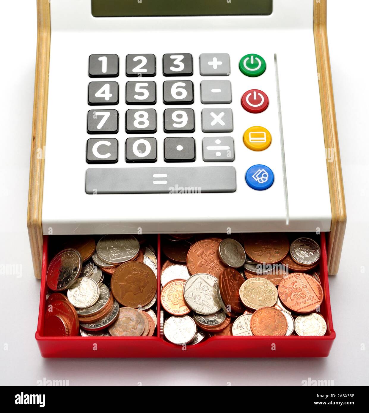 Children's play cash register cash till,with drawer full of small change Stock Photo