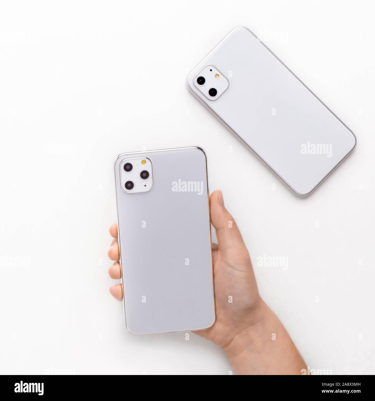 Customer holding new IPhone 11 Pro in silver set Stock Photo
