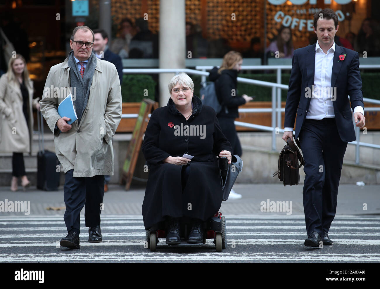 Liberal Democrat President Sal Brinton flanked by lawyer Adam Chapman (left) and Liberal Democrat chief executive Mike Dixon, arriving at the Royal Courts of Justice, London, before making a statement regarding the editorial decision by ITV to keep remain out of the upcoming Leaders Debates. Stock Photo