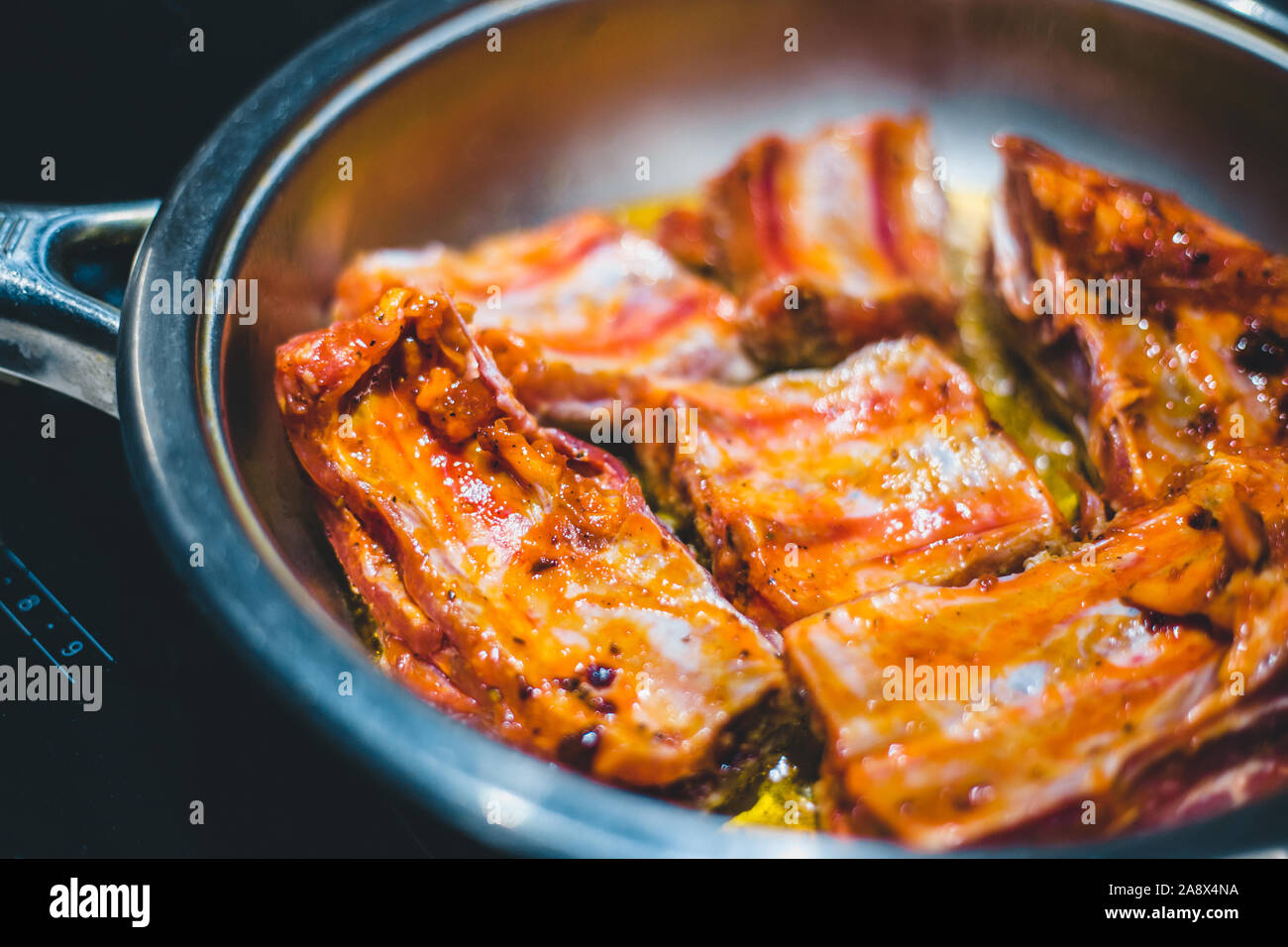Pork ribs in spicy tomato sauce Stock Photo Alamy