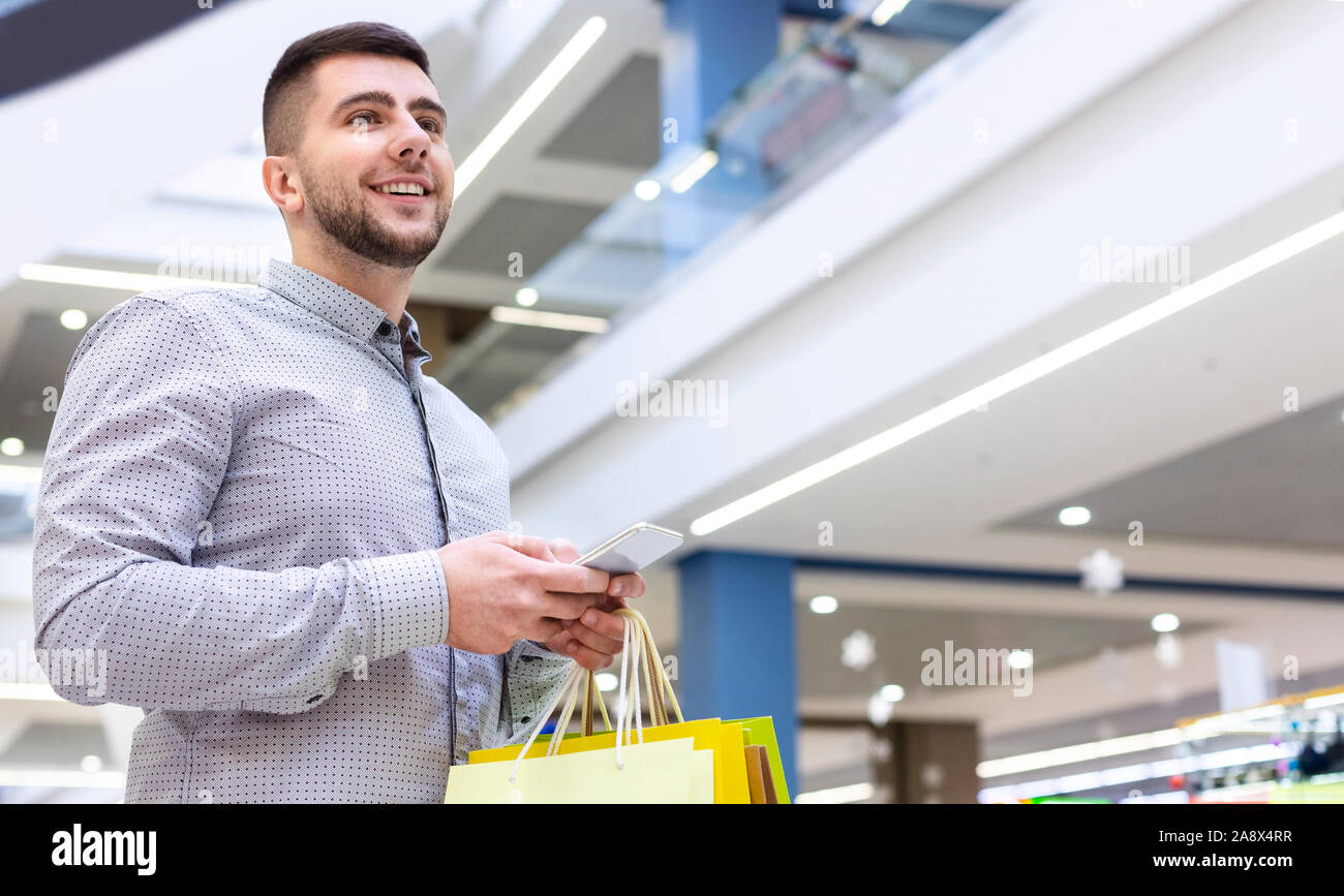 Young happy man smartphone walking hi-res stock photography and images ...