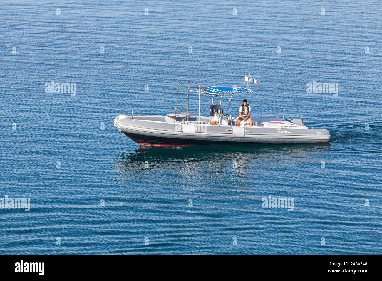 Ajaccio, France - June 30, 2015: Pilot boat with a man on board is in port of Ajaccio, Corsica Stock Photo