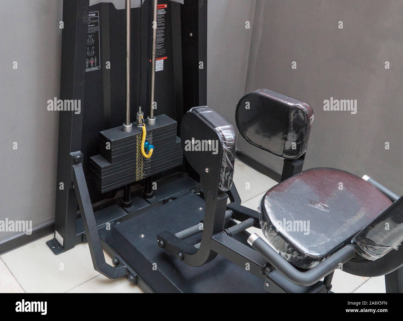 stack weights in gym bodybuilding equipment Stock Photo - Alamy