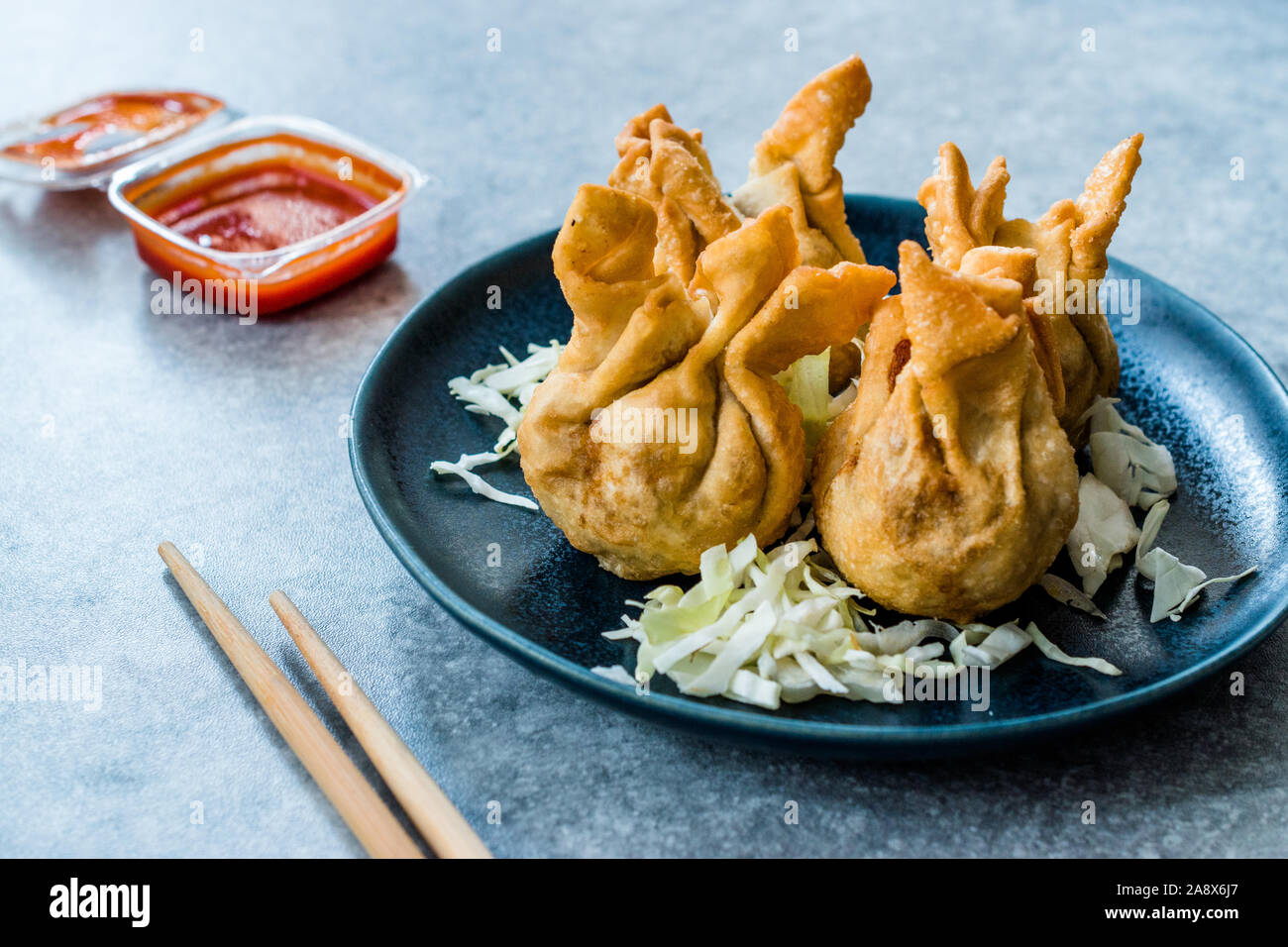 Nepalese Traditional Deep Fried Dumpling Momos served with Tomato