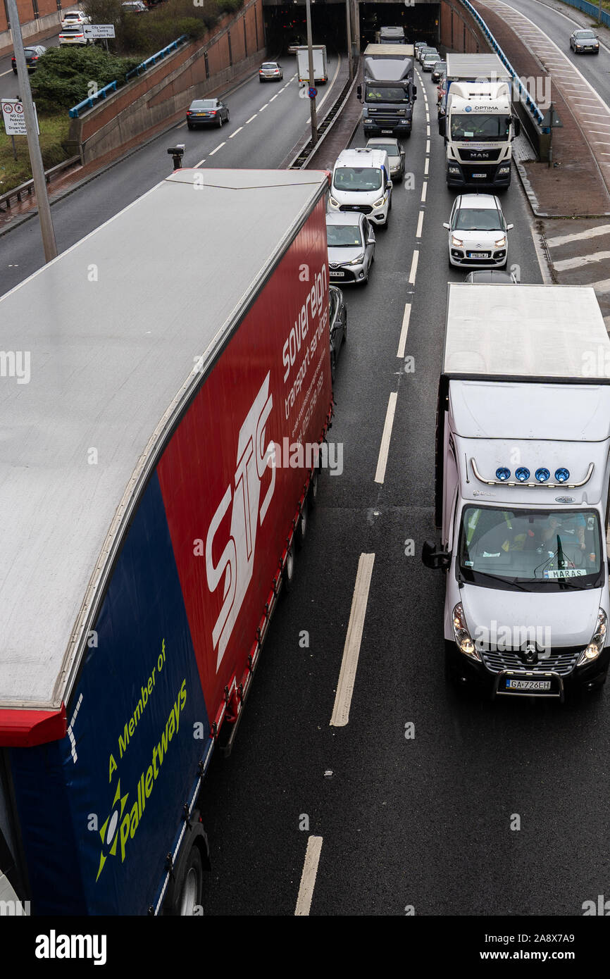 Logistic lorries and haulage vehicles, cars and work transport stuck in a traffic jam, stand still, congestion, gridlock on the A50 by Meir tunnel Stock Photo