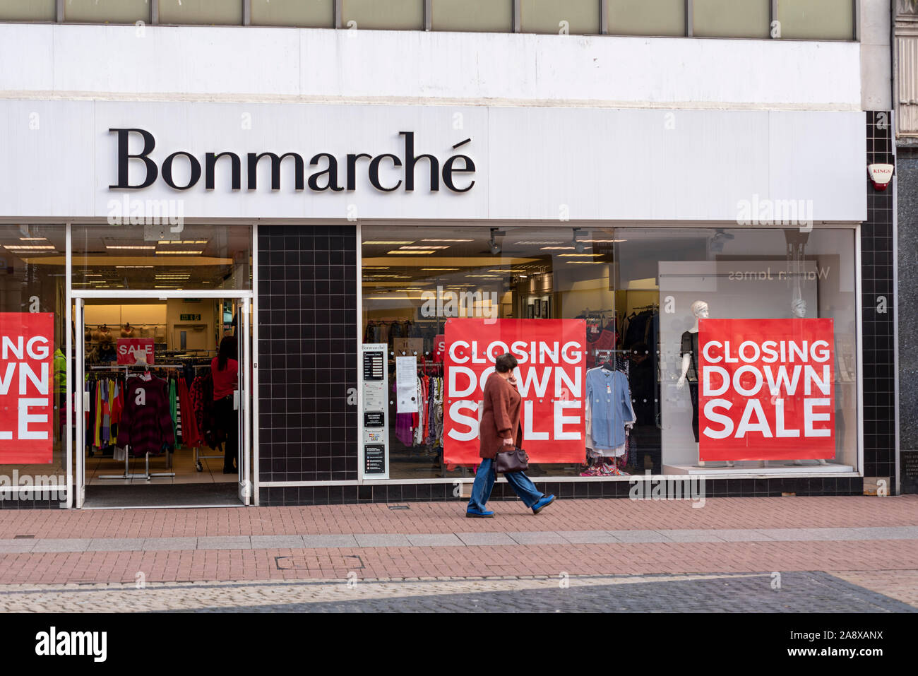 Bonmarche fashion shop store in High Street, Southend on Sea, Essex, UK with closing down sale signs in shop window. In administration. Passer by Stock Photo