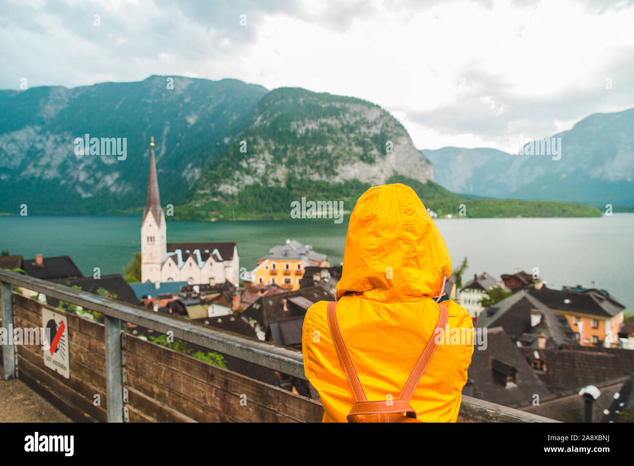 Woman in raincoat from behind hi-res stock photography and images - Alamy