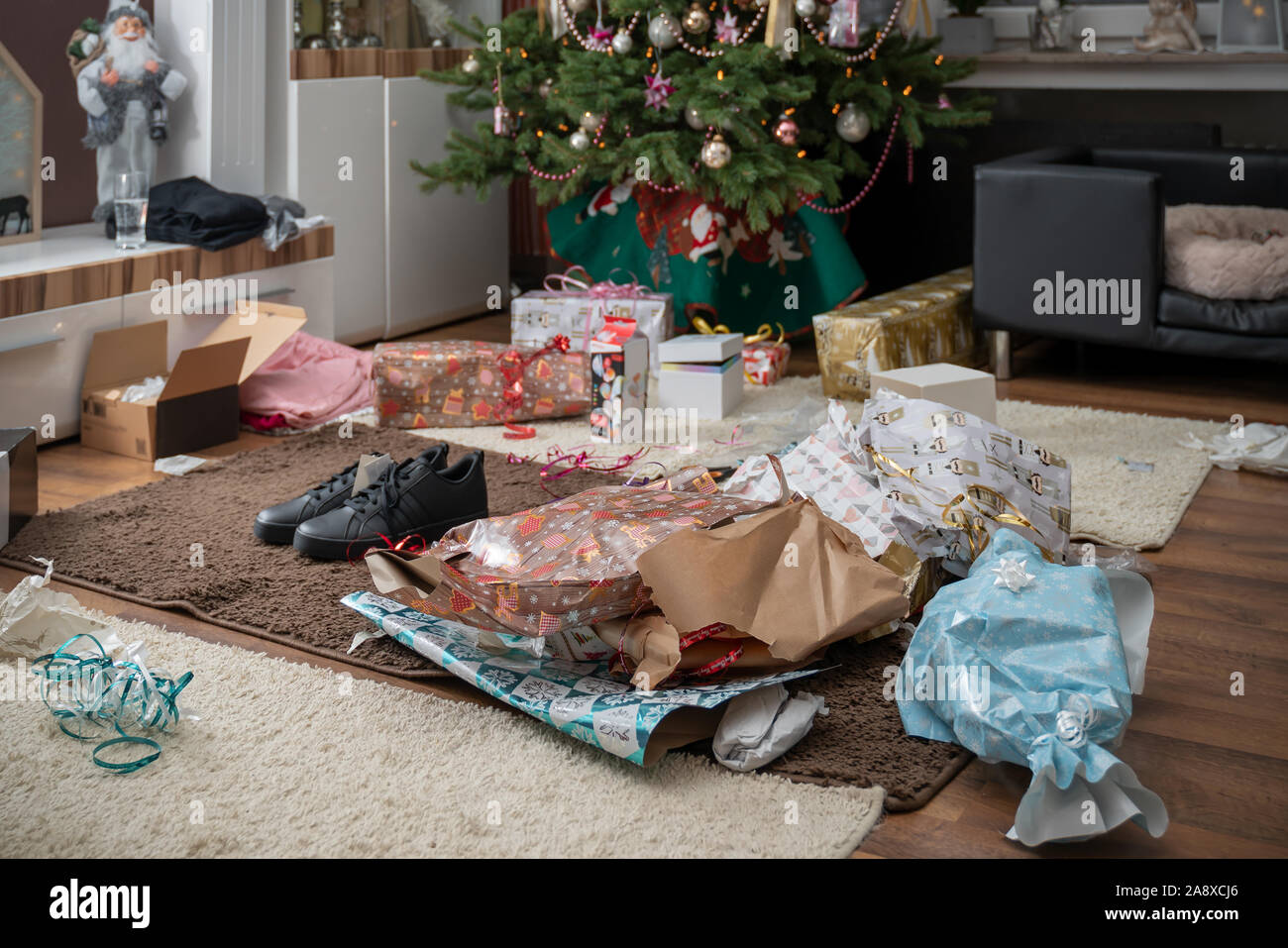 It Is Holy Night The Gifts Are Unpacked There Is A Mess Of Wrapping Paper And Boxes Throughout The Living Room Authentic Picture From Private Party Stock Photo Alamy