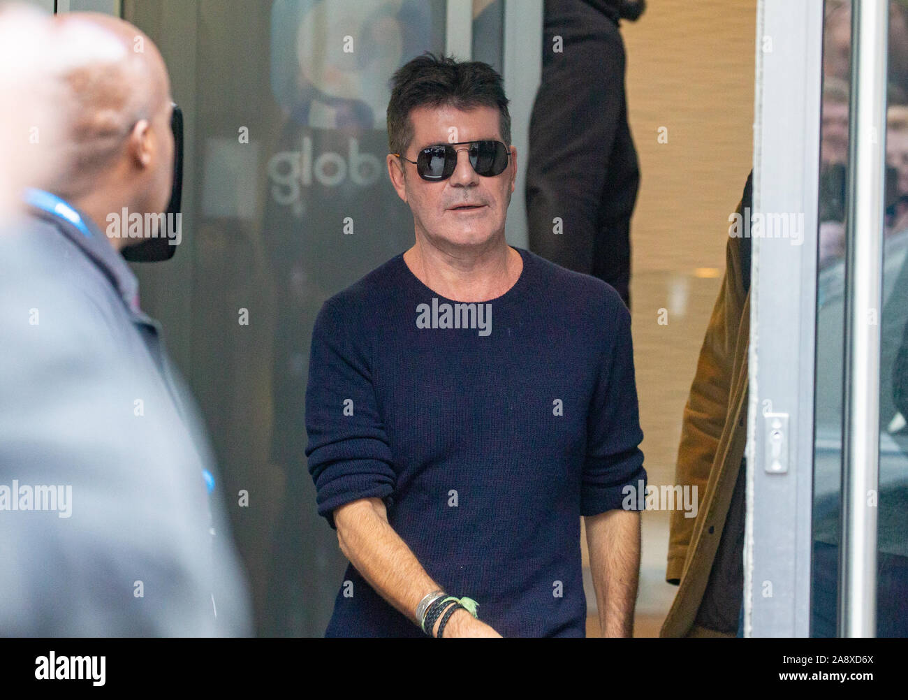 Simon Cowell, Television, music and Talent Show judge, producer and businessman, leaves the Studios of Heart FM after giving an interview. Stock Photo