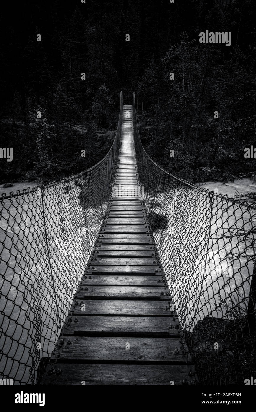 Black and White Wooden Suspended Bridge, Mount Robson Hiking Trail. Stock Photo