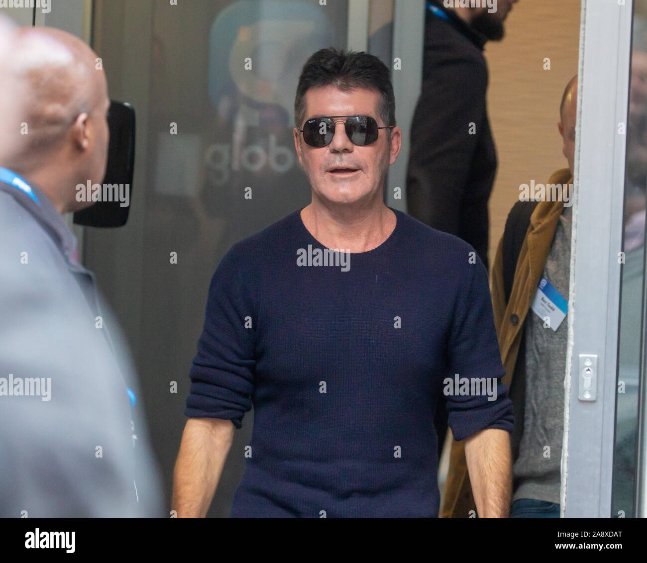 Simon Cowell, Television, music and Talent Show judge, producer and businessman, leaves the Studios of Heart FM after giving an interview. Stock Photo
