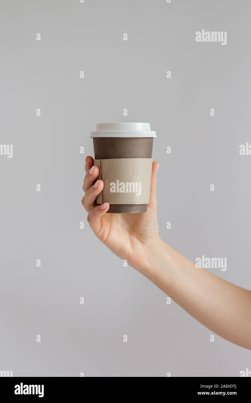 Mockup Of Woman Hand Holding A Coffee Paper Cup Stock Photo Alamy