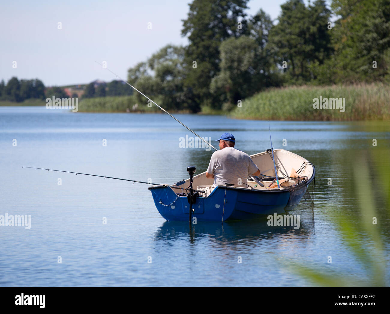 fisherman on a boat, fishing in Poland Stock Photo