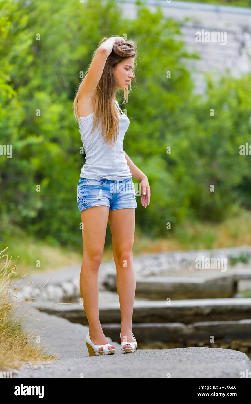 Adolescent sexy teen aka young woman legs heels Stock Photo - Alamy