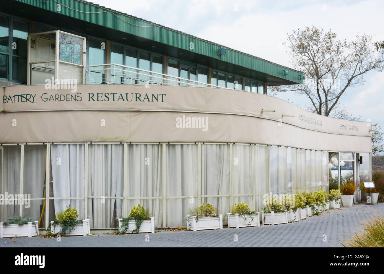 New York, NY - 05 NOV 2019: Battery Gardens Restaurant, a harborside restaurant featuring traditional American plates, a beer garden and patio bar, in Stock Photo