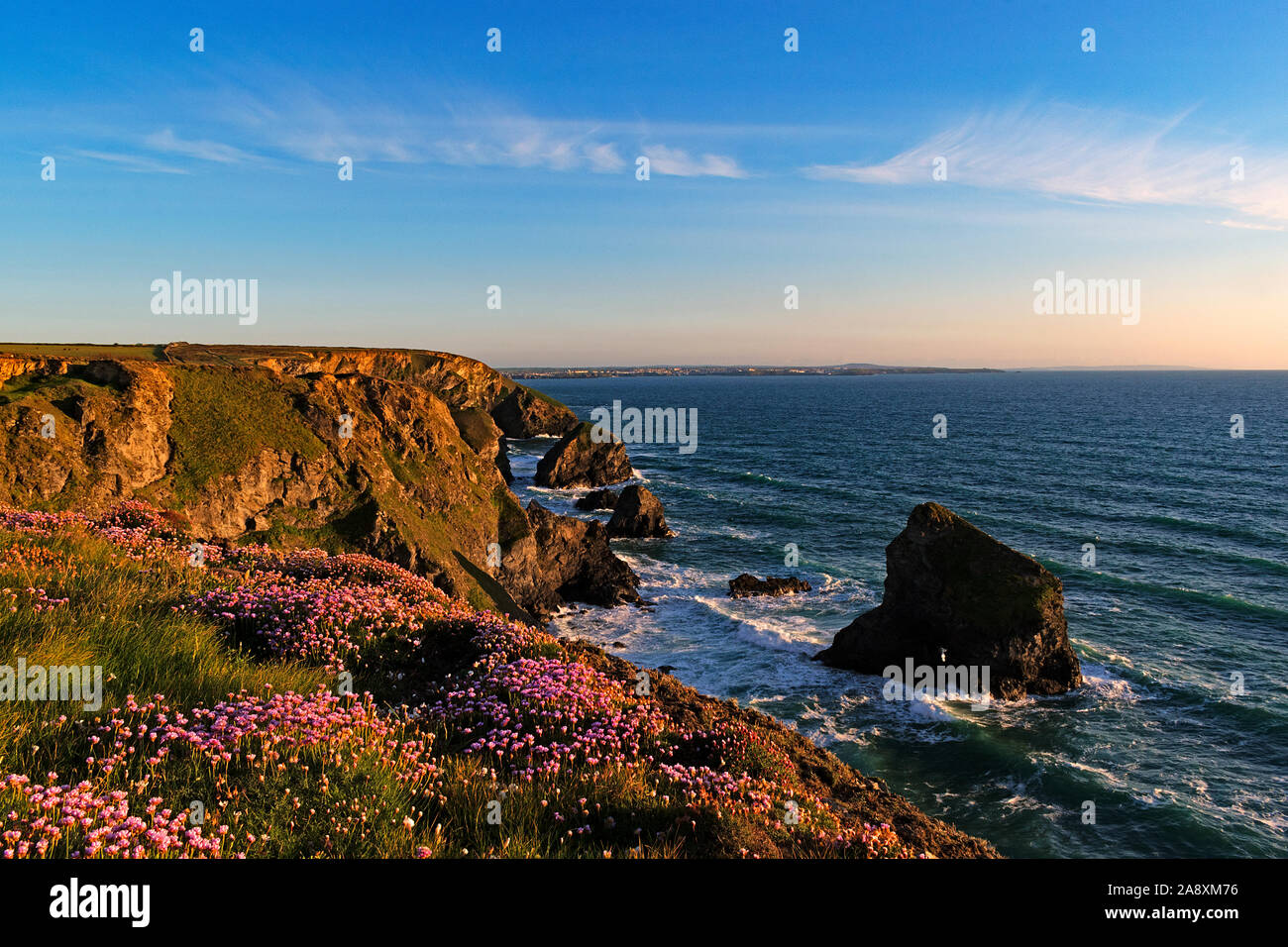 sunset at bedruthan steps in cornwall, england, britain, uk. Stock Photo