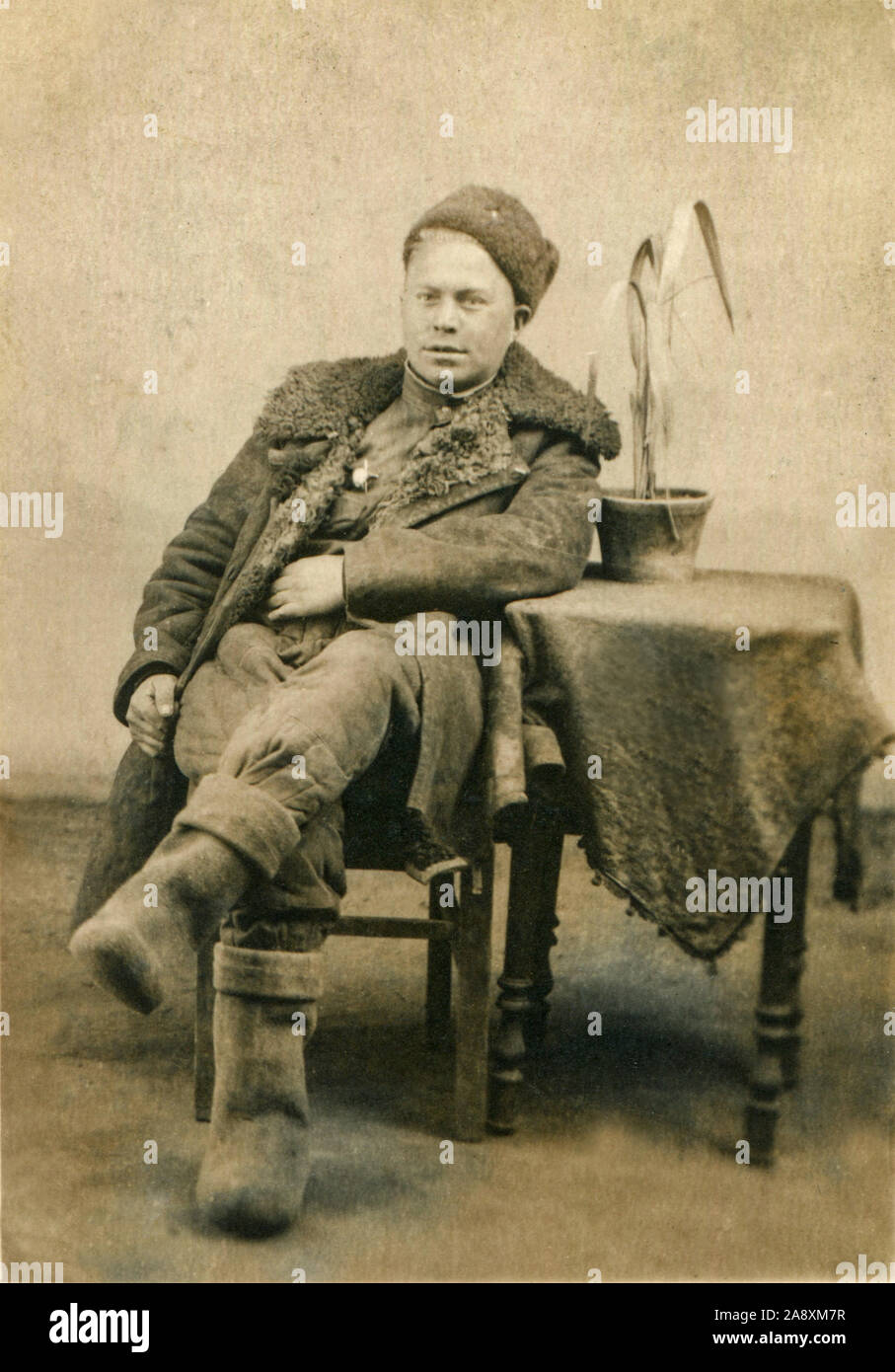 1946 year. March 23rd. Manguria. Dunan city. The Red Army was based in China. Military in winter uniform. On it a sheepskin coat, boots, hat - a kubanka. Stock Photo