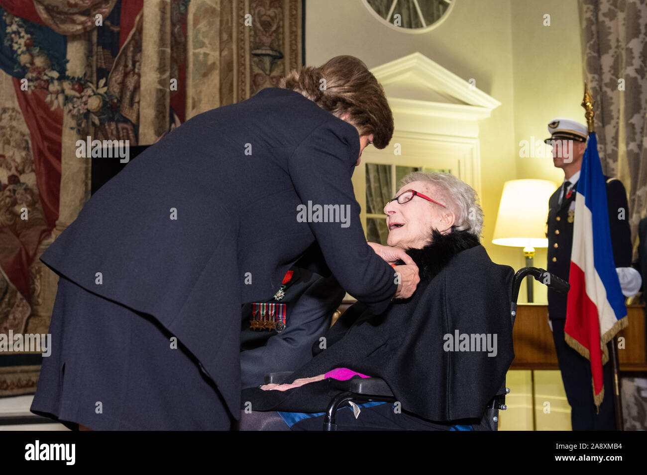 French Ambassador the the UK Catherine Colonna presents Jean Neal with