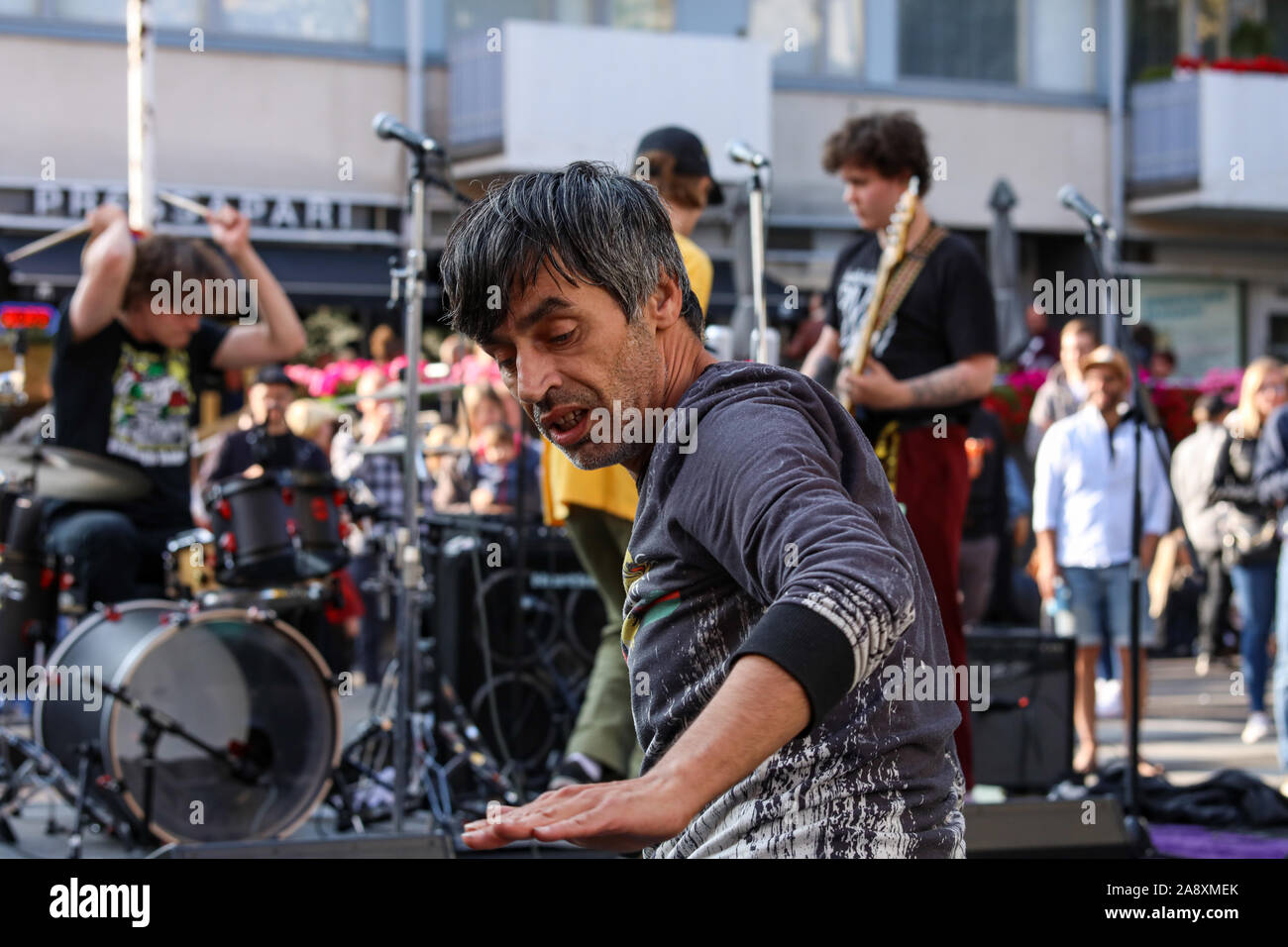 Middle-aged man dancing to the music of a local band at Kallio Block Party 2019 in Helsinki, Finland Stock Photo