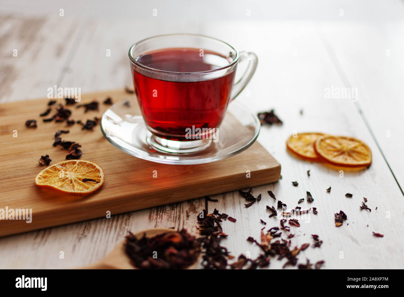 Cup of hibiscus tea (karkade, red sorrel, Agua de flor de Jamaica) on a  table. Drink made from magenta calyces (sepals) of roselle flowers Stock  Photo - Alamy