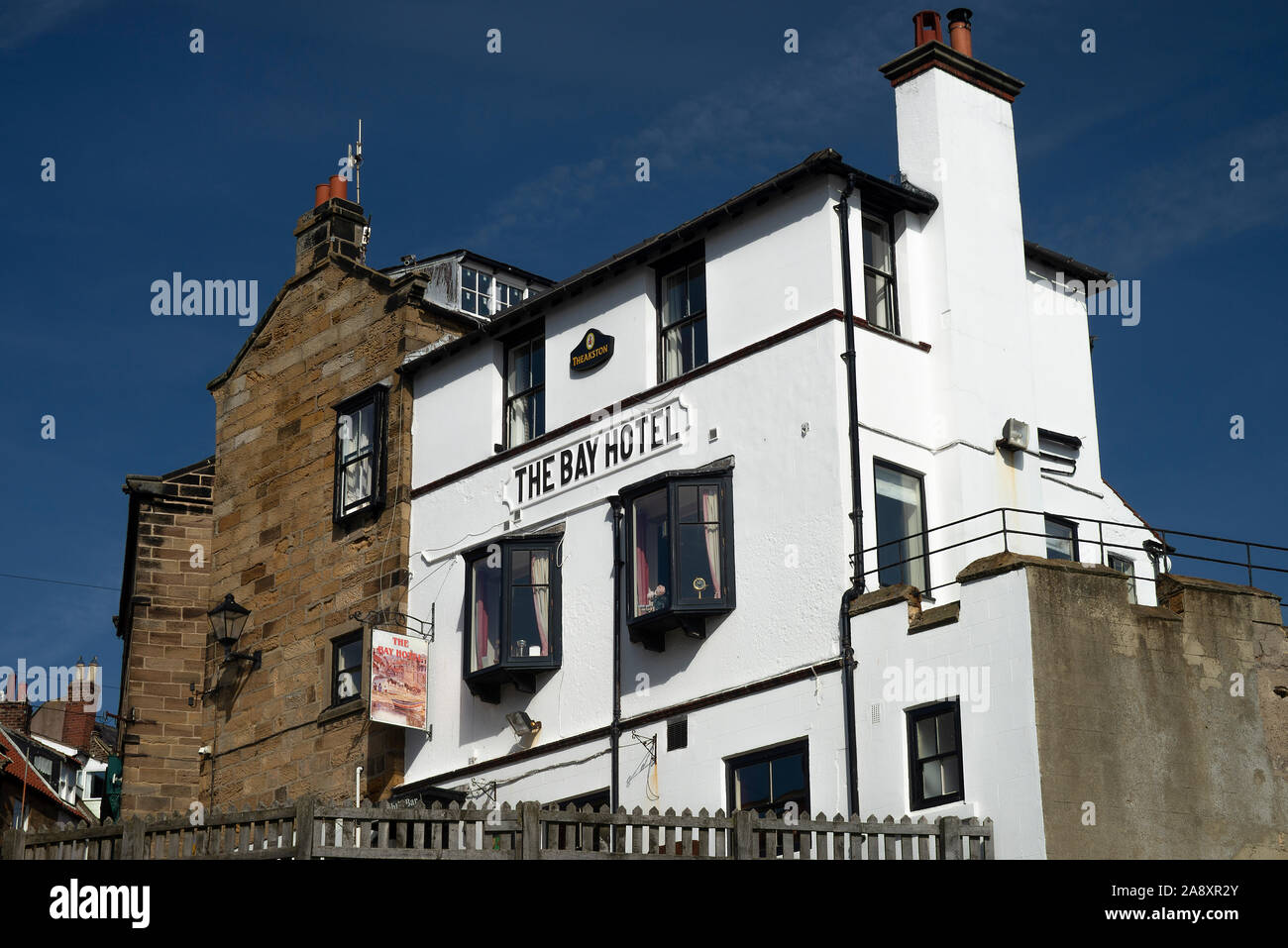 The Dramatic Bay Hotel in the Beautiful Seaside Village of Robin Hoods Bay in North Yorkshire England United Kingdom UK Stock Photo