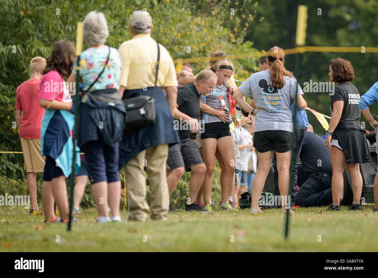 Lancaster, Ohio / USA - 9/24/2016: Exhaustion overwhelms competitor at the Bob Reall Invitational Cross Country Track Meet. Stock Photo