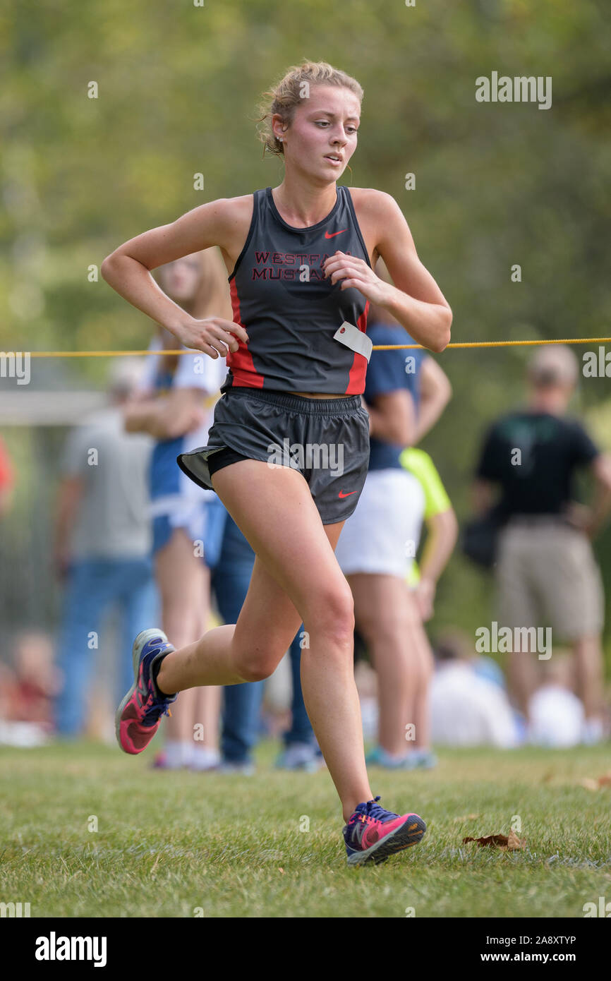 Lancaster, Ohio / USA - 9/24/2016: Athlete coming down the final stretch at the Bob Reall Invitational Cross Country Track Meet. Stock Photo