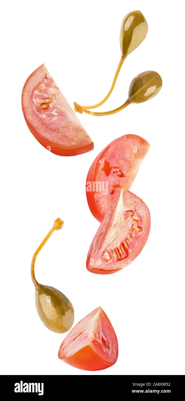 floating parsley and tomatoes isolated on white background Stock Photo