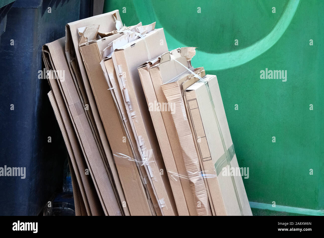 Cardboard and waste paper is collected and packaged for recycling. Cardboard is bundled into bales. Urban Recycling. Stock Photo