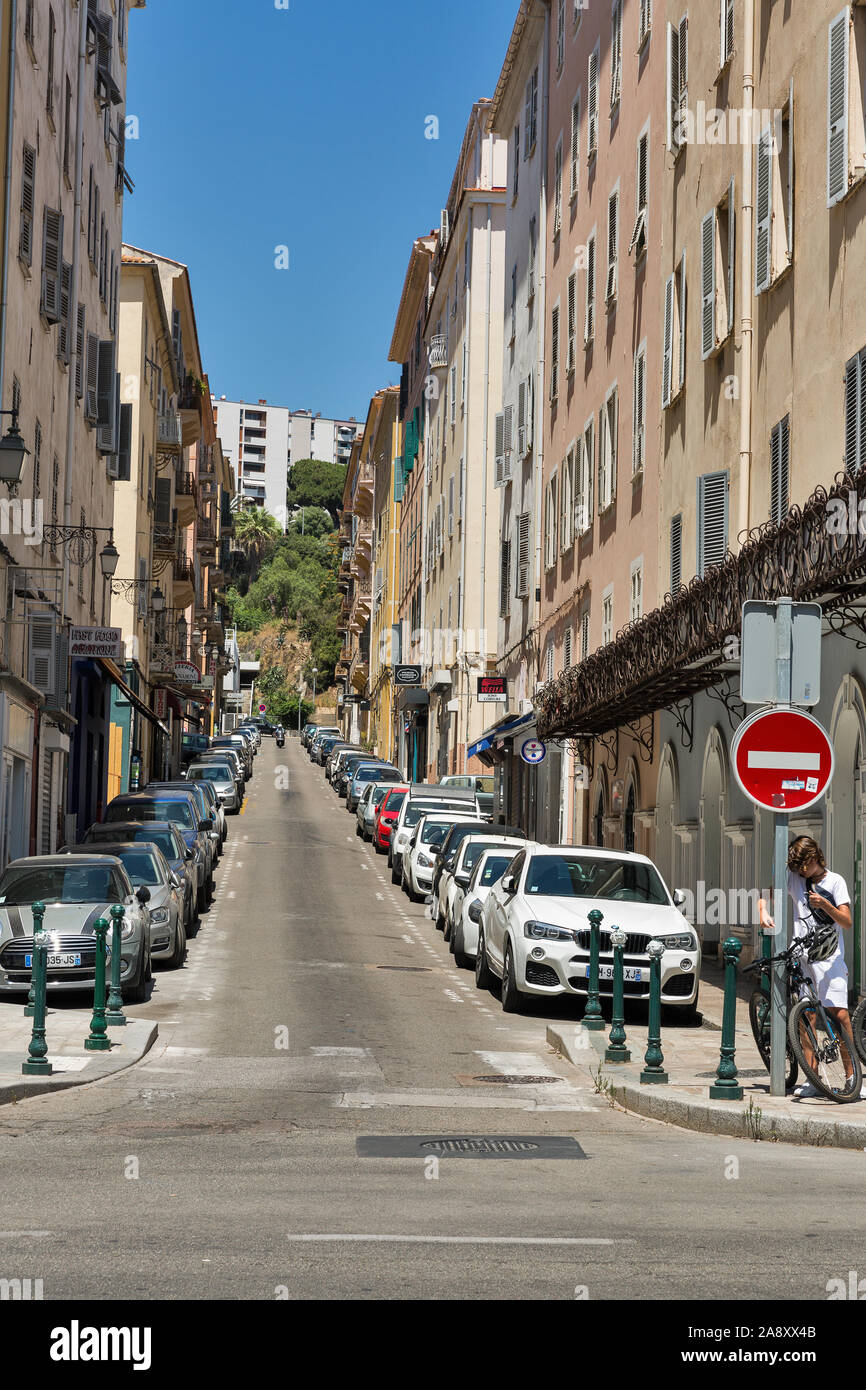 AJACCIO, CORSICA, FRANCE - JULY 13, 2019: Cars parked along Marechal Ornano narrow street in city center. Ajaccio, the largest settlement on the islan Stock Photo