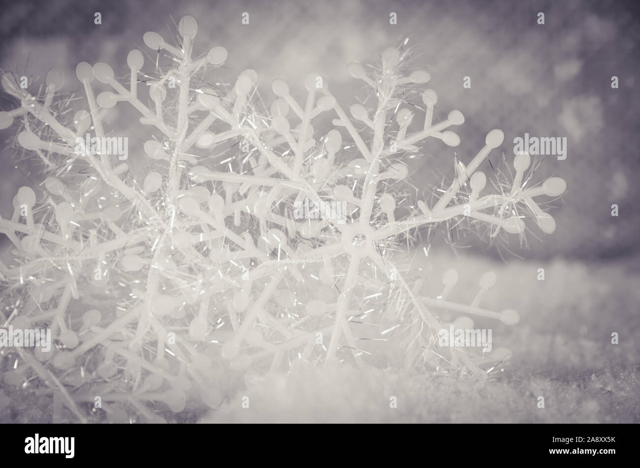 simple white snowflake decoration in snowy background Stock Photo - Alamy