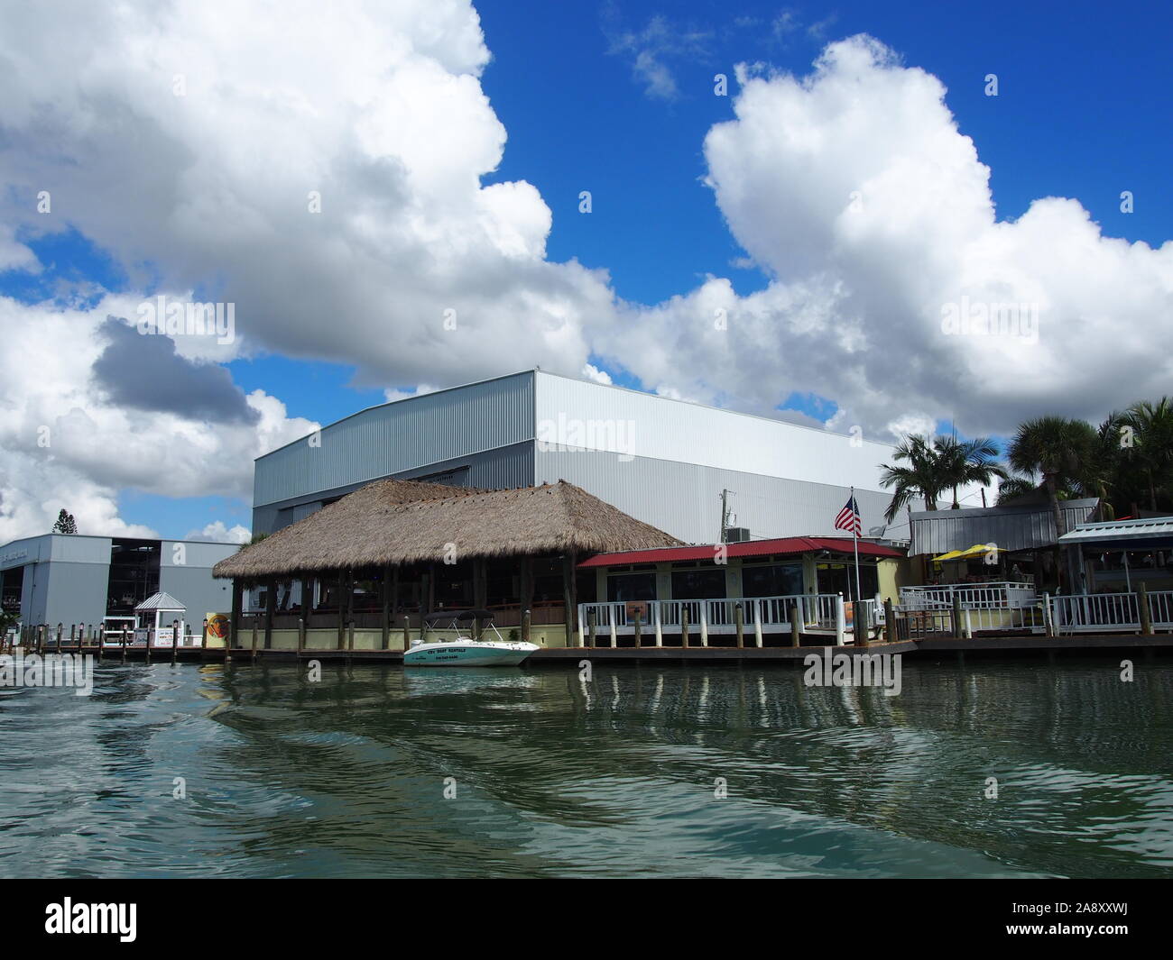 Pop's Tropical Grill and Gulf Harbor Marina along the Intracoastal Waterway in Nokomis, Florida, USA, October 30, 2019, © Katharine Andriotis Stock Photo