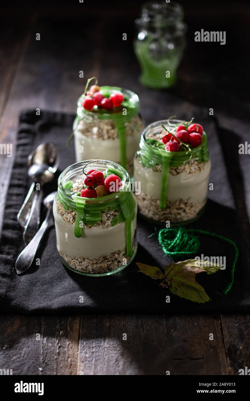 breakfast of oatmeal with natural yogurt and matcha topping fit food Stock Photo