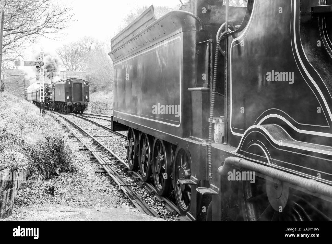 Black railway stop at station Stock Photo