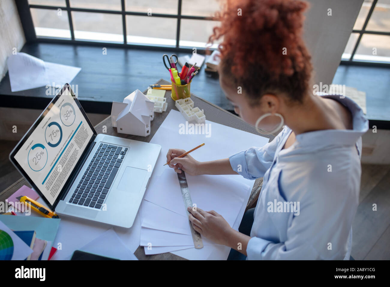 Woman with ruler hi-res stock photography and images - Alamy