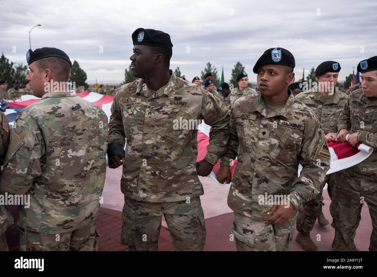 El Paso, Texas, USA. 11th Nov, 2019. Soldiers of 1st Battalion, 77th Armor Regiment, 3rd Armored Brigade Combat Team ''Bulldog'', 1st Armored Division, carry an American flag during a Veteran's Day celebration in El Paso, Texas. Credit: Joel Angel Juarez/ZUMA Wire/Alamy Live News Stock Photo