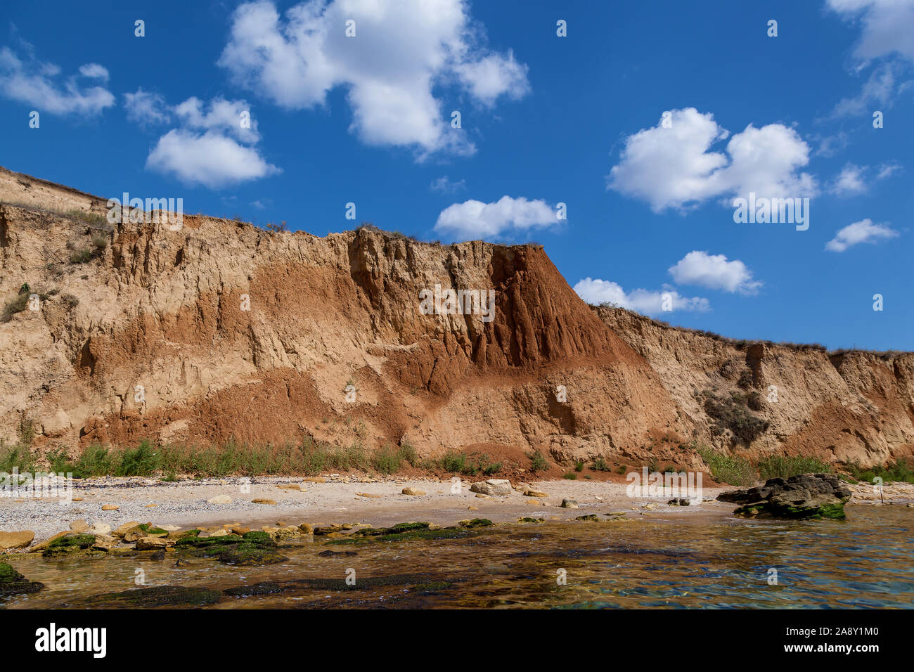 Yellow sandy rocks and stones of various forms on the Black Sea coast ...