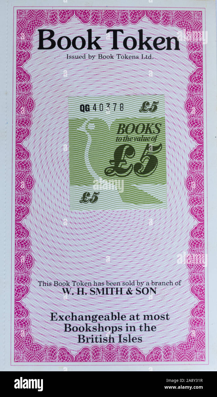 Old-fashioned book token worth £5 (five pounds sterling) sold by W H Smith & Son exchangeable at most bookshops in the british isles Stock Photo