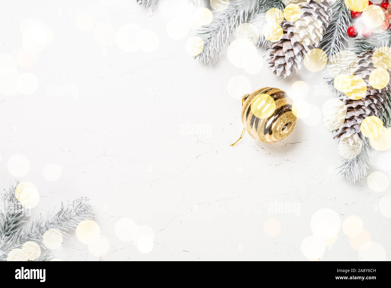 Christmas background with fir tree and decorations on white Stock Photo ...