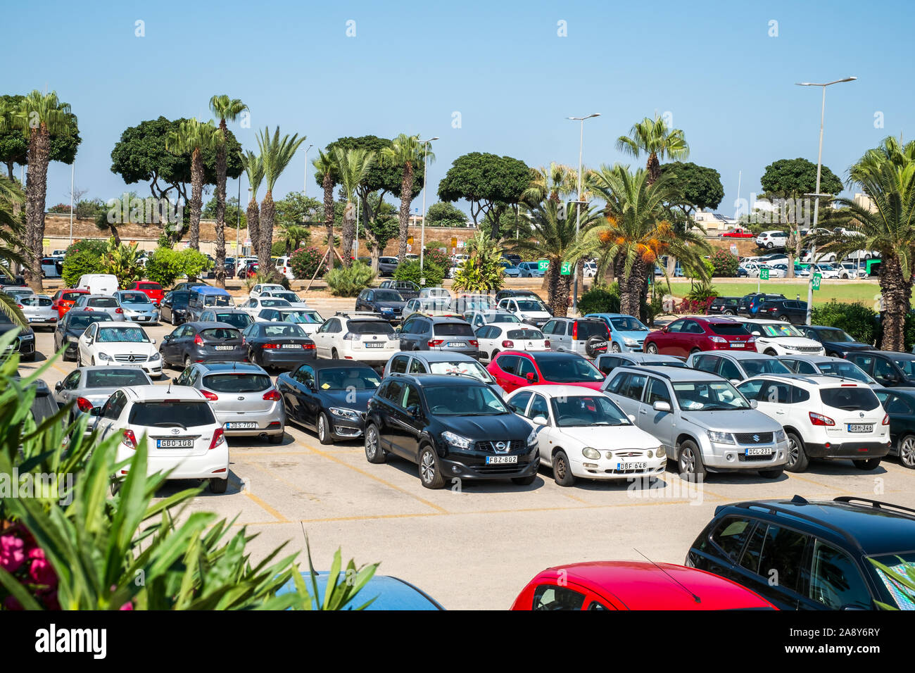 Gudja, Malta - July 24, 2019. Parking space with cars in the Malta  international Airport Stock Photo - Alamy