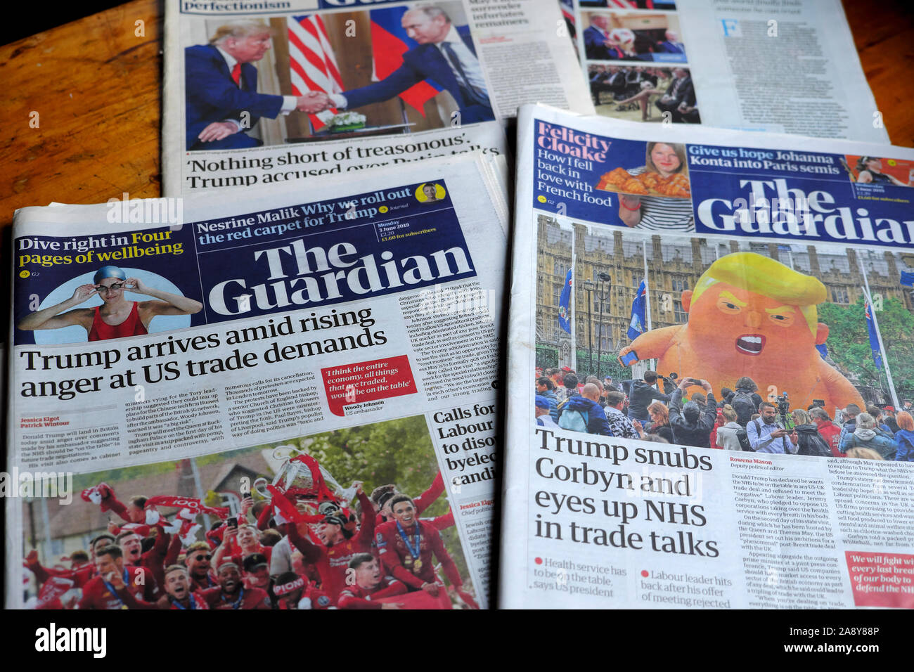 'Trump arrives amid rising anger at US trade demands' and on visit Trump balloon in front page newspaper headlines in the Guardian London Britain UK Stock Photo